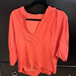 Splendid. Size small fits like a medium. Lose fitting 3-4 length sleeve.